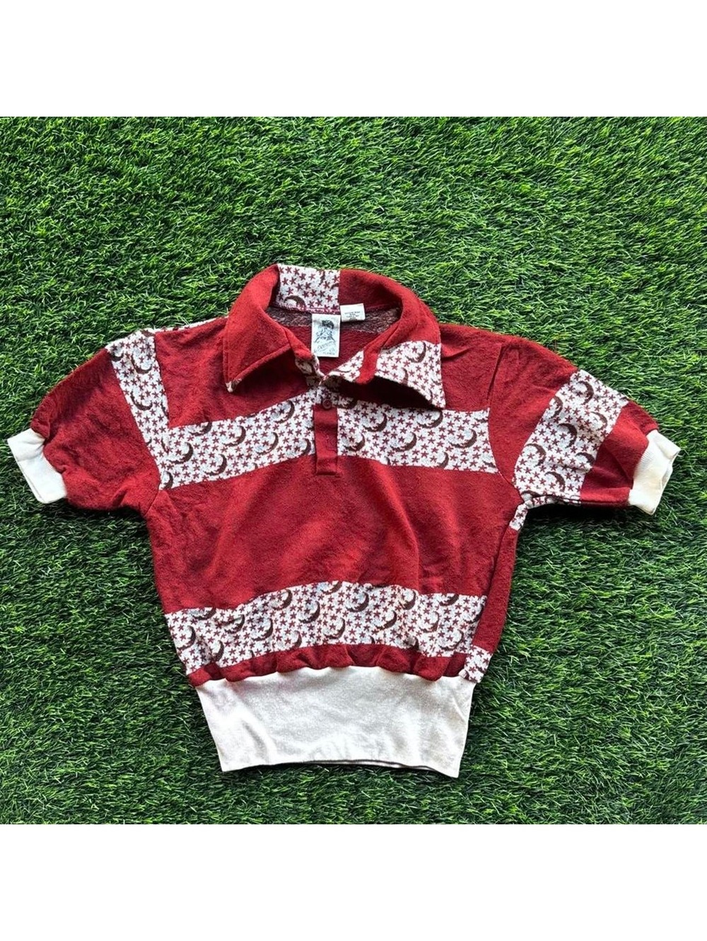Step back into the 1970s with this ultra-unique vintage cropped polo